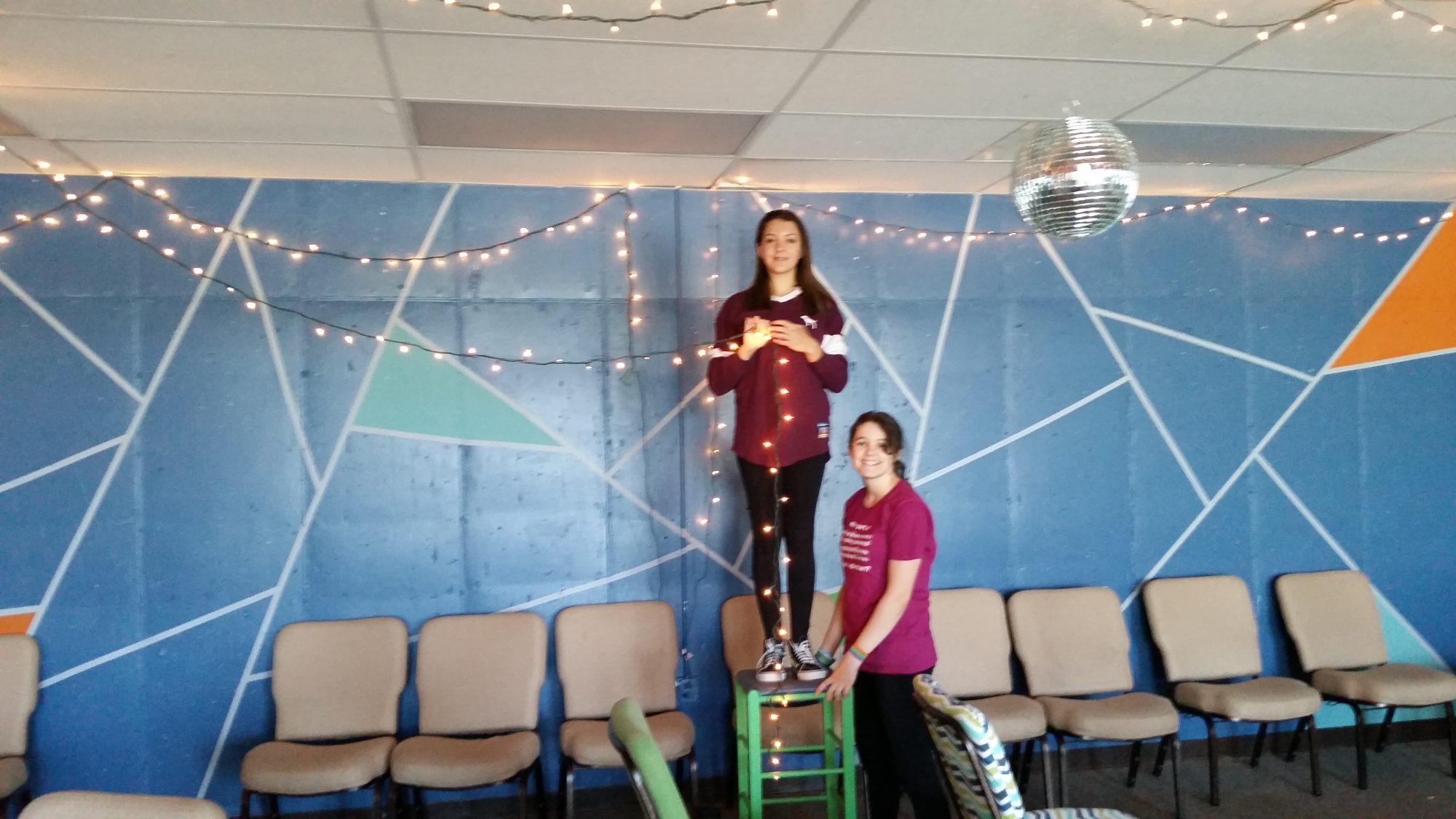 Two girls decorating the youth room at Parker United Methodist Church