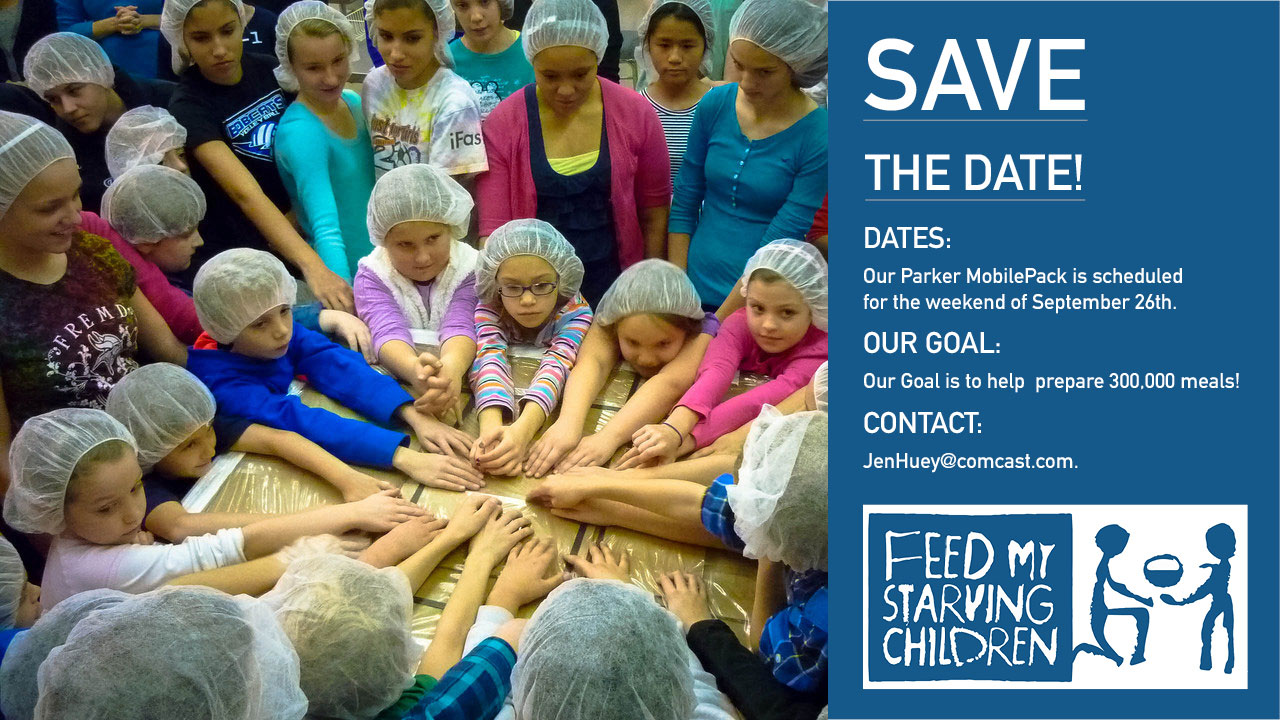 Youth and kids wearing hairnets praying over Feed My Starving Children food boxes