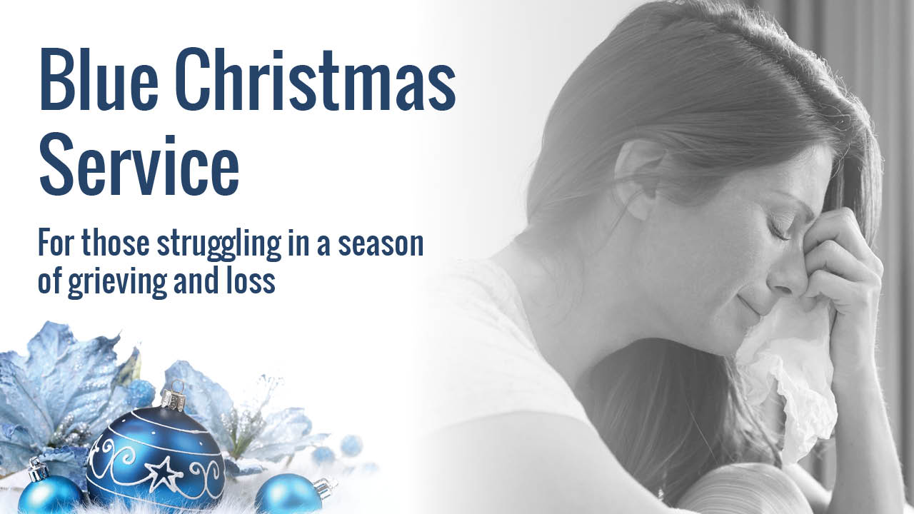 photo of woman crying with tissue and blue Christmas Decorations