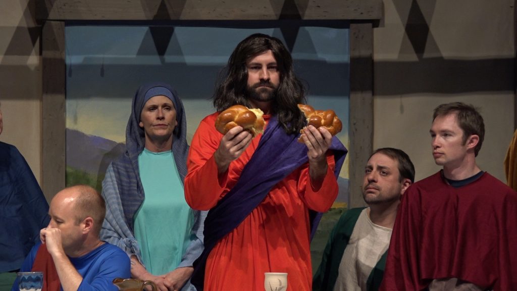 Dalton Shaffer portrays Jesus breaking the bread at the Last Supper