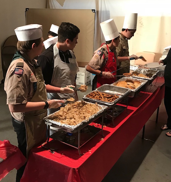 Boy Scouts serving breakfast