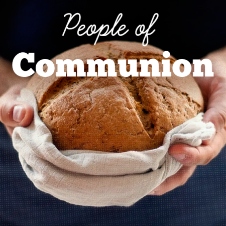 Photo of man holding communion bread wrapped in towel